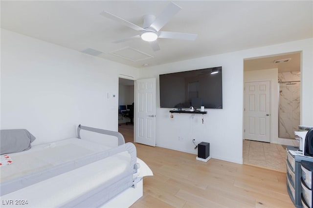 bedroom with light hardwood / wood-style floors and ceiling fan