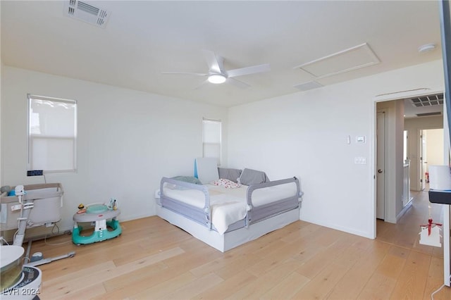 bedroom featuring wood-type flooring and ceiling fan