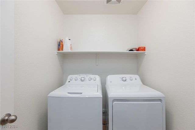 washroom with washer and dryer