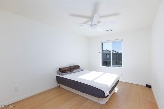 bedroom featuring ceiling fan and light hardwood / wood-style flooring