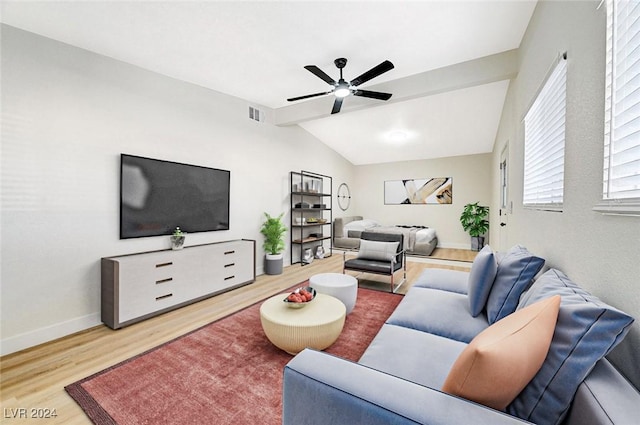 living room with ceiling fan, hardwood / wood-style floors, and lofted ceiling