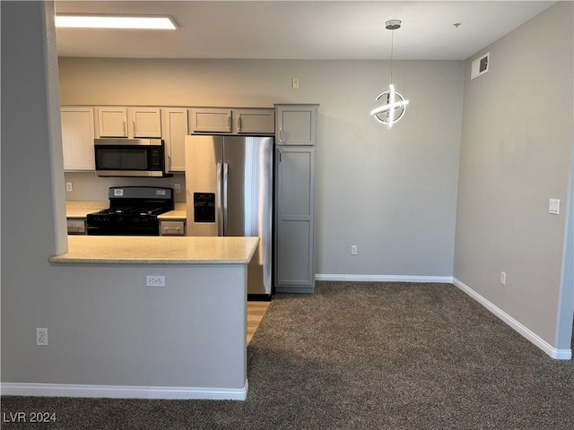 kitchen featuring gray cabinetry, pendant lighting, stainless steel appliances, and dark colored carpet