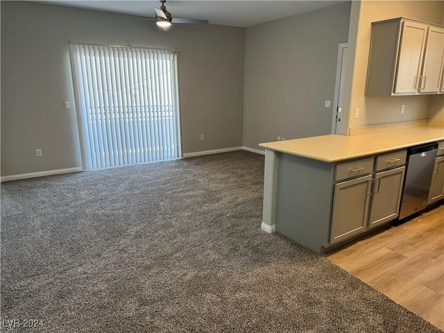 kitchen featuring stainless steel dishwasher, ceiling fan, gray cabinets, light wood-type flooring, and kitchen peninsula