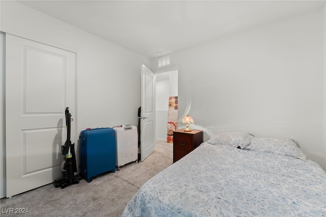 bedroom featuring light colored carpet