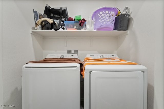 laundry room with washing machine and dryer