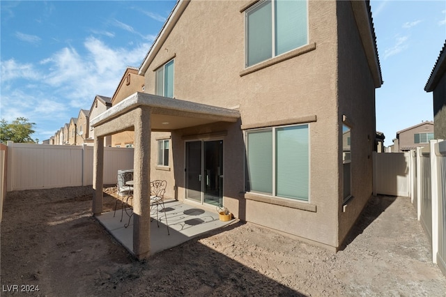 rear view of house with a patio