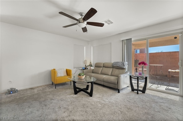 living room with ceiling fan and carpet