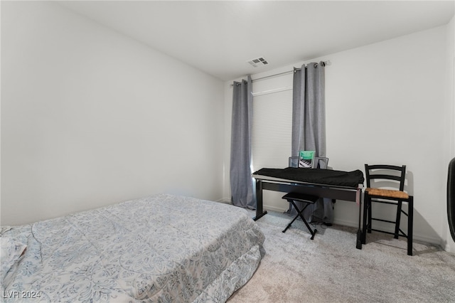 bedroom featuring light colored carpet