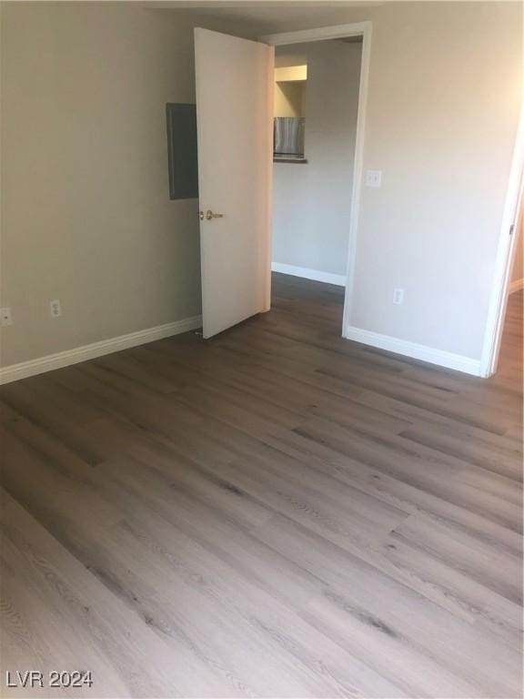 spare room with hardwood / wood-style flooring