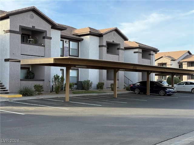 exterior space with a carport