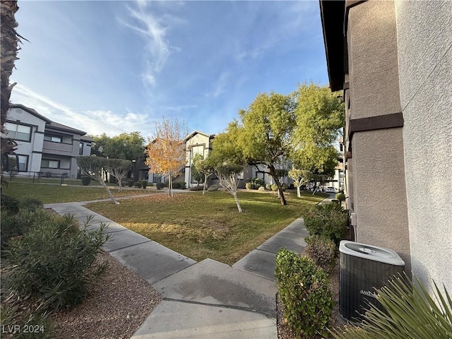 view of home's community featuring a lawn