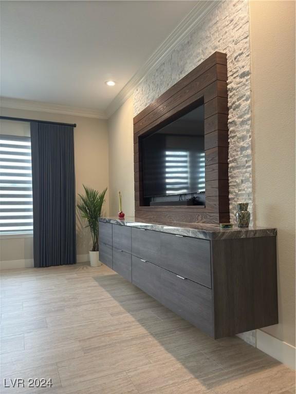 interior space featuring light hardwood / wood-style flooring and ornamental molding