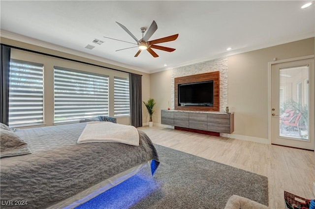 bedroom featuring ornamental molding, light wood-type flooring, and ceiling fan