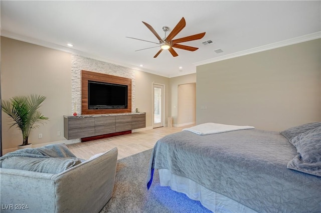 bedroom featuring crown molding, ceiling fan, and light hardwood / wood-style flooring