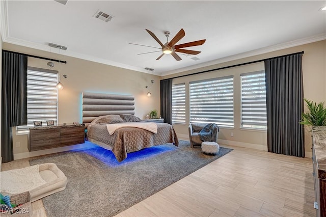 bedroom with crown molding and ceiling fan