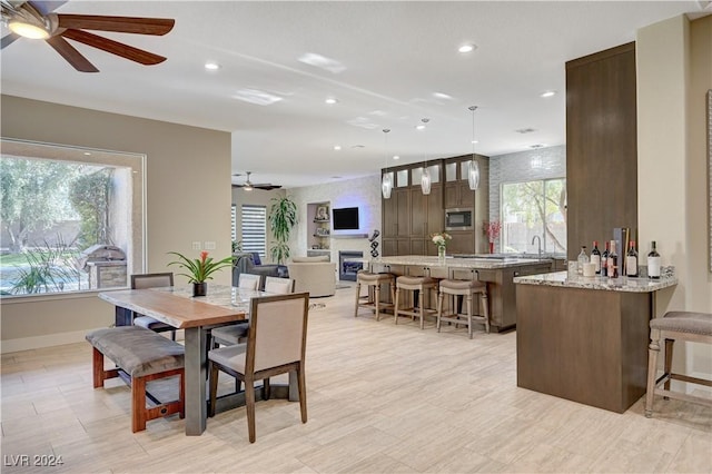 dining room with sink and ceiling fan