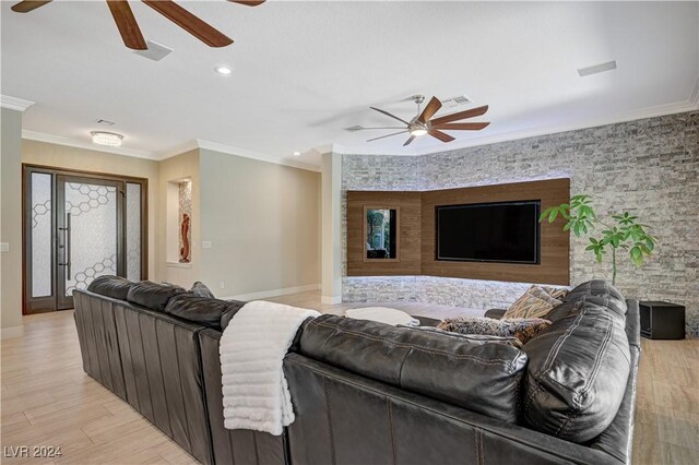 living room featuring ornamental molding and light hardwood / wood-style floors