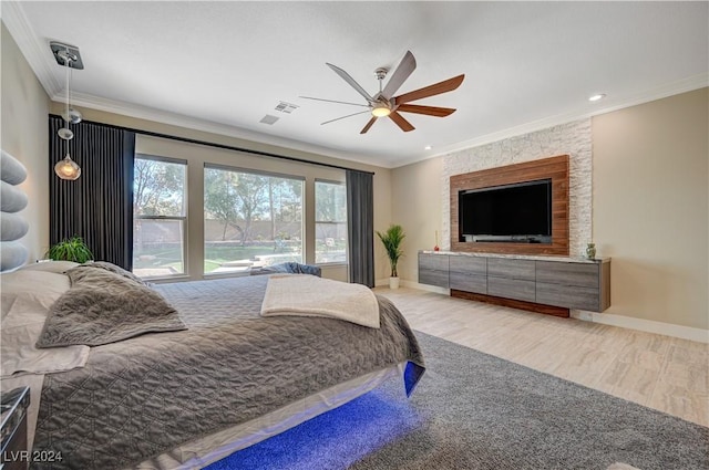 bedroom with crown molding, ceiling fan, and light hardwood / wood-style flooring