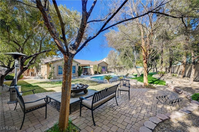 view of patio / terrace with a fenced in pool