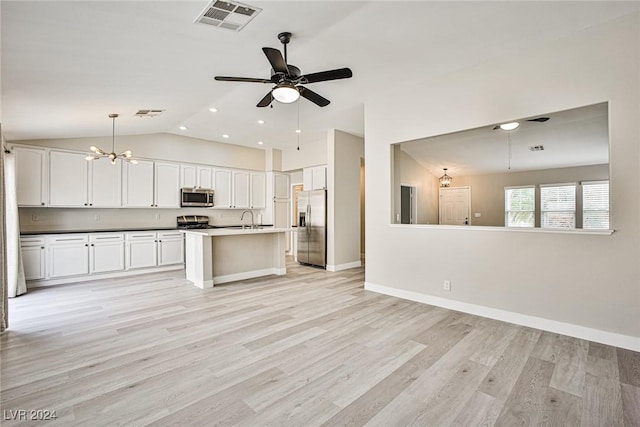 kitchen featuring ceiling fan with notable chandelier, stainless steel appliances, pendant lighting, light hardwood / wood-style floors, and white cabinetry