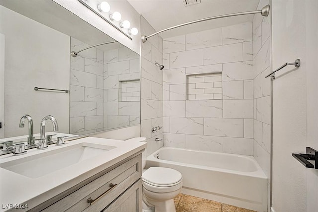 full bathroom with vanity, toilet, and tiled shower / bath