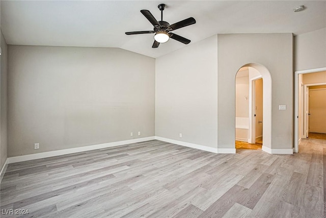 unfurnished room with light wood-type flooring, vaulted ceiling, and ceiling fan