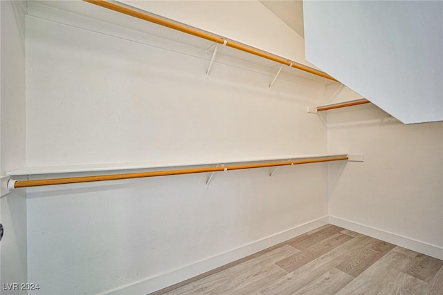 walk in closet featuring light hardwood / wood-style floors