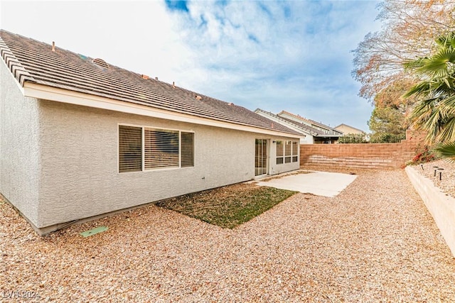 back of property featuring a patio