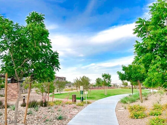 view of home's community featuring a lawn