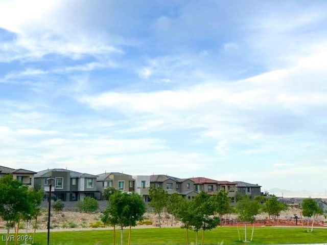 view of property's community with a lawn