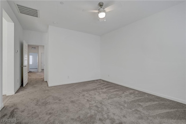 unfurnished room featuring light carpet and ceiling fan