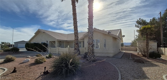 view of side of home featuring a garage