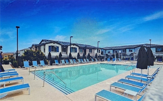 view of swimming pool featuring a patio area