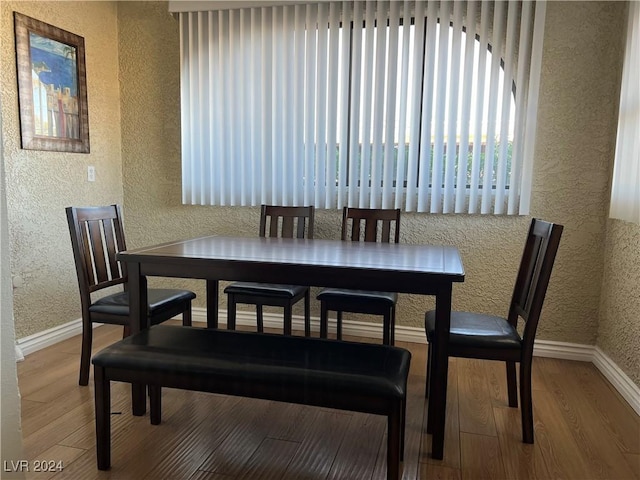 dining room with wood-type flooring