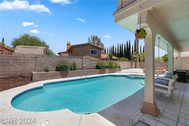 view of pool featuring a patio