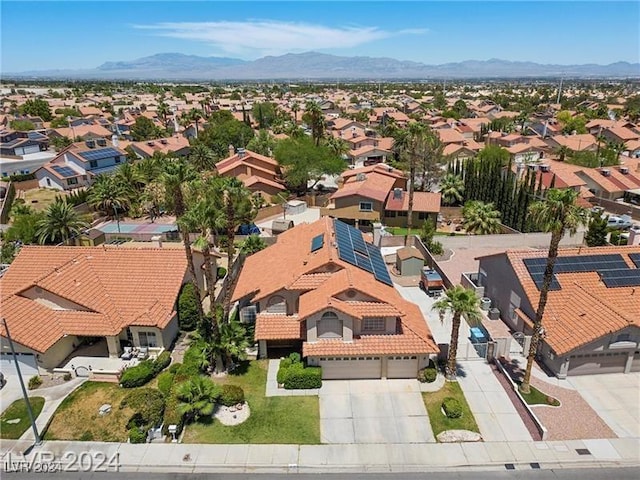 birds eye view of property featuring a mountain view