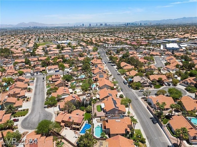 birds eye view of property with a mountain view