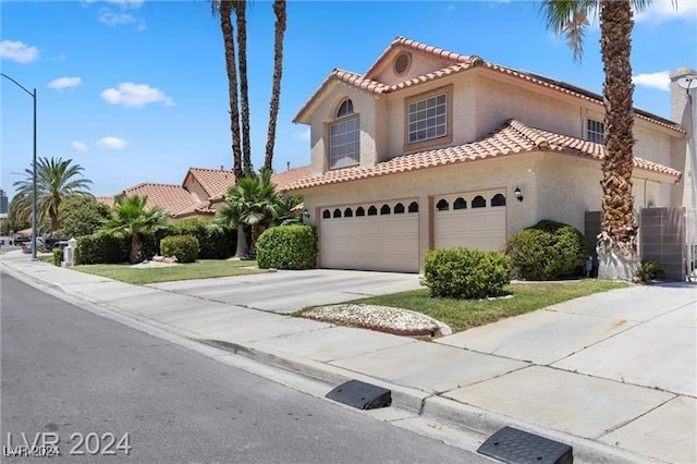 mediterranean / spanish-style house featuring a garage