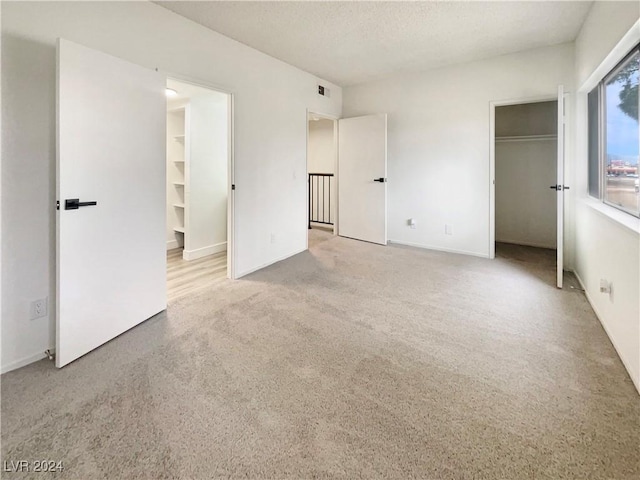 unfurnished bedroom with a textured ceiling