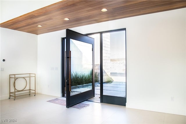 doorway with wooden ceiling and french doors