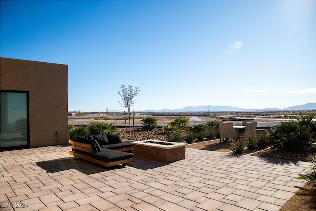 view of patio / terrace with a mountain view