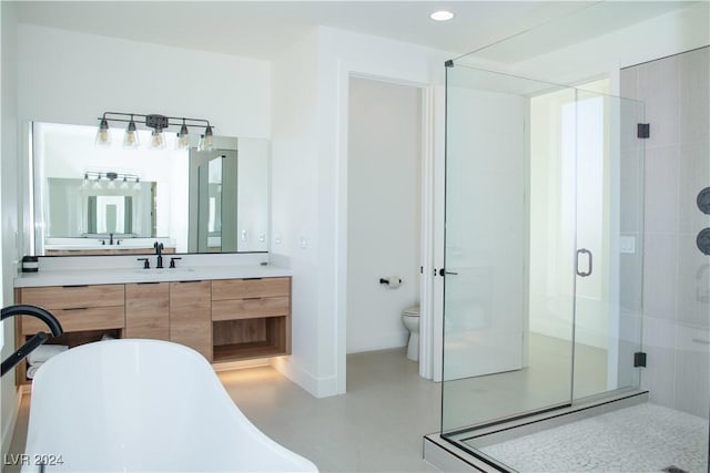 full bathroom featuring vanity, separate shower and tub, toilet, and concrete flooring