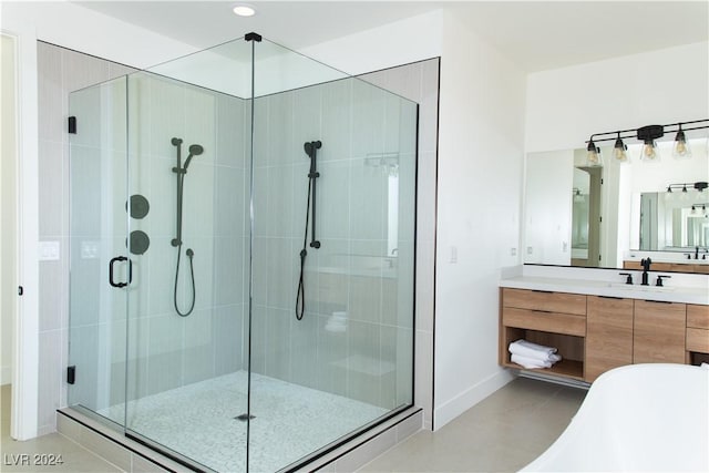 bathroom with vanity and independent shower and bath