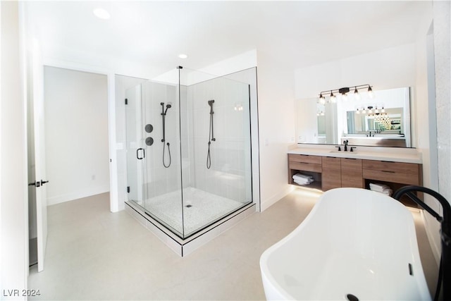 bathroom featuring vanity, separate shower and tub, and concrete flooring