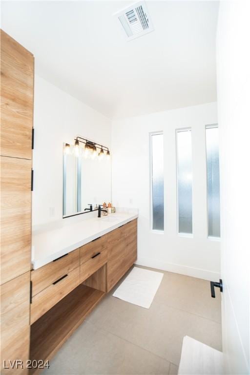 bathroom with vanity and tile patterned floors