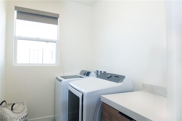 washroom featuring washing machine and clothes dryer