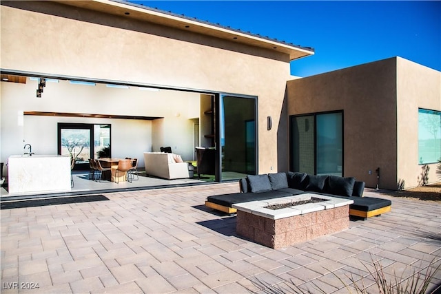 view of patio featuring a fire pit