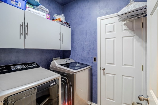 laundry room featuring cabinets and independent washer and dryer