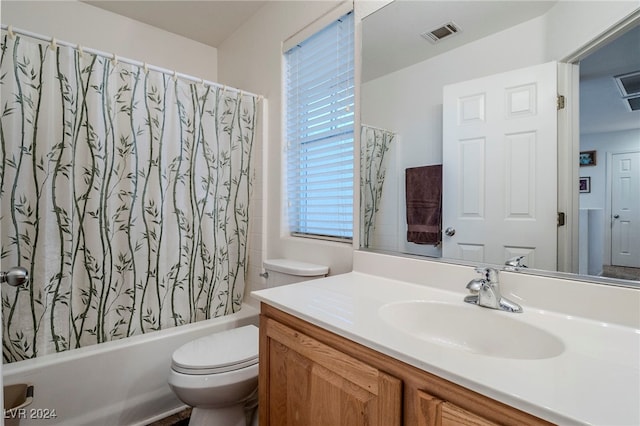 full bathroom featuring vanity, toilet, and shower / bath combo