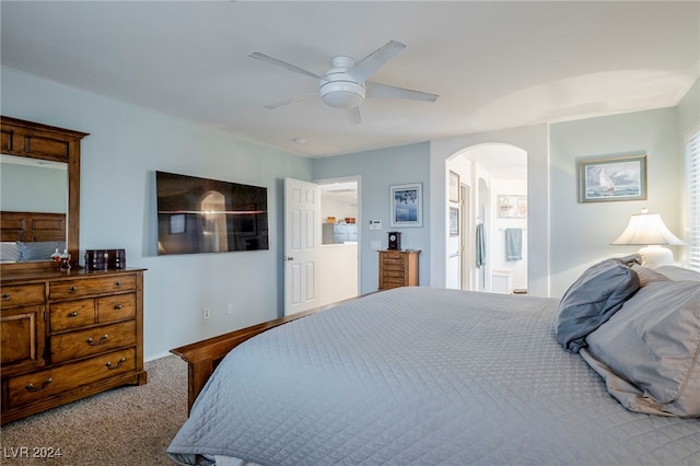 bedroom with carpet, ceiling fan, and ensuite bathroom